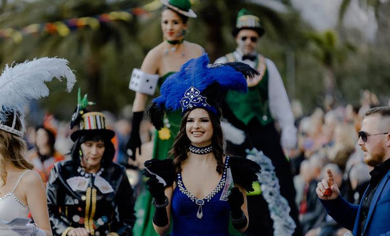 women in costume parade through the streets of Kotor during the Kotor Carnival
